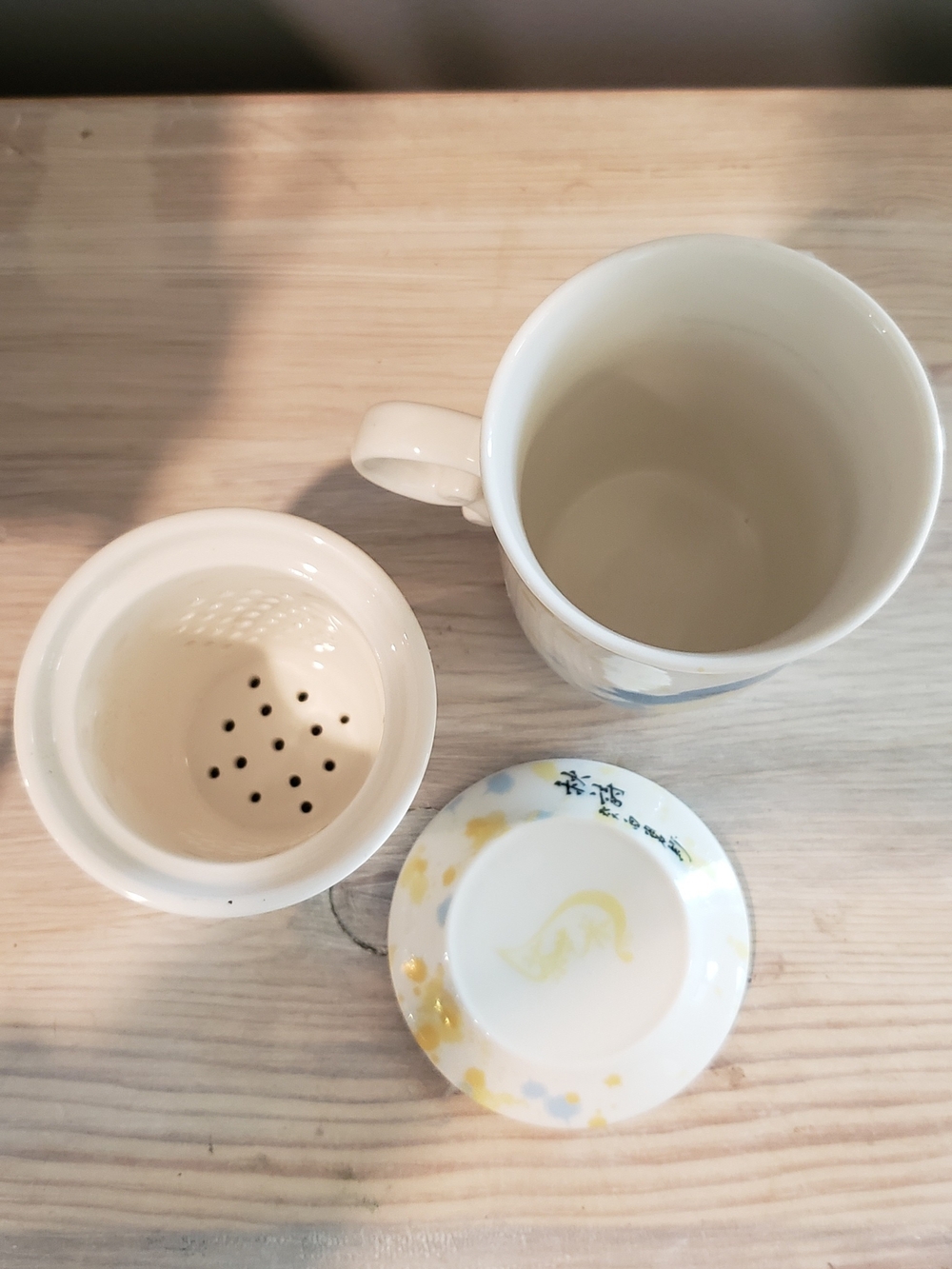 Whimsical White Ceramic Tea Infuser with Blue & Yellow Bird Motif - Picture 4 of 5